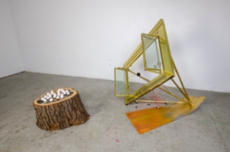 In Between Times; 2016; found stump; found fireplace facad; reused computer fans; firest hunting print; electric tea candles; steel; mixed media; dimensions variable